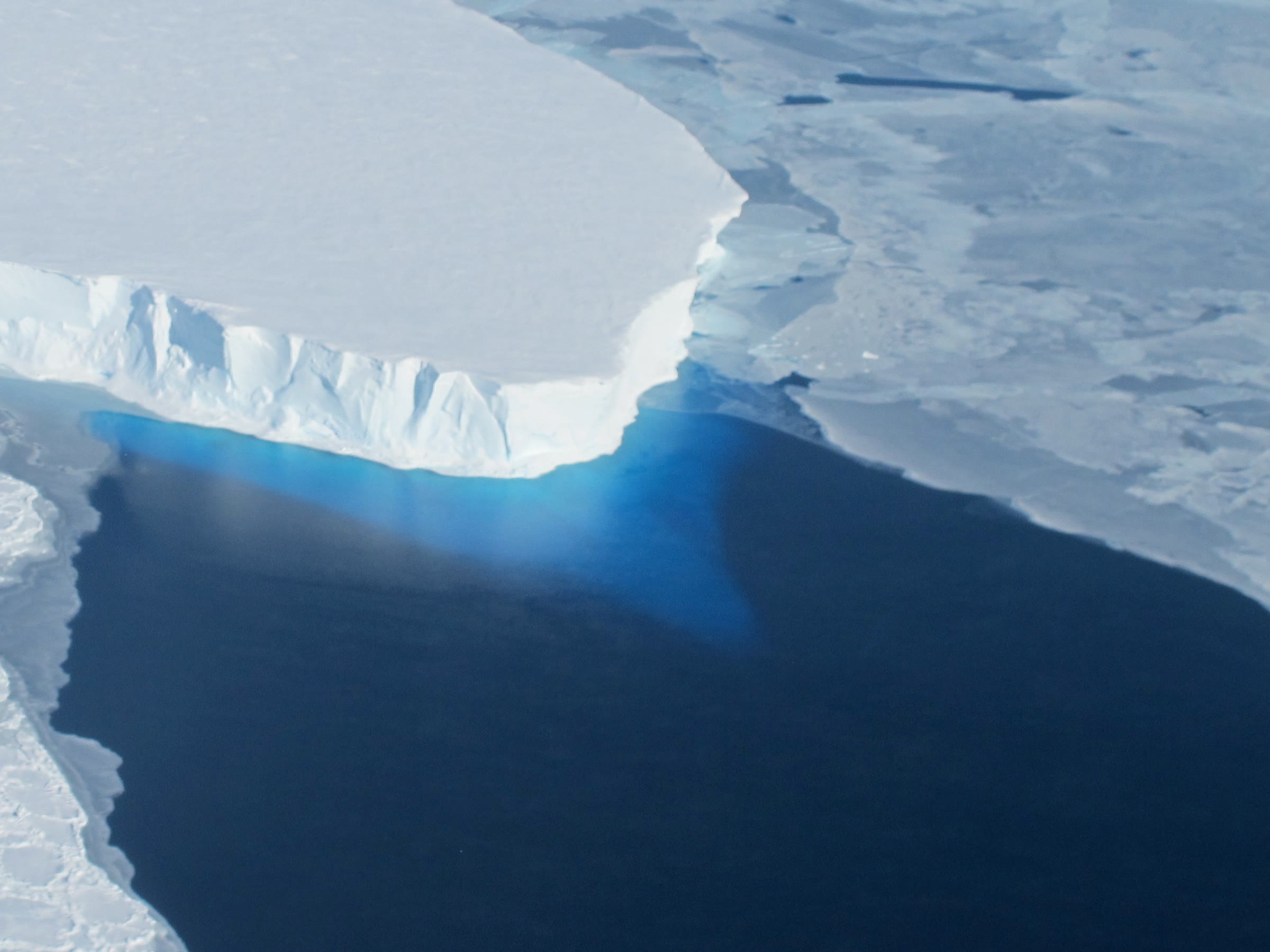 Calving front of Thwaites Ice Shelf, Amundsen Sea, photographed on a NASA IceBridge flight: the class of ice the 2024 research vision discusses, not a built seabed curtain