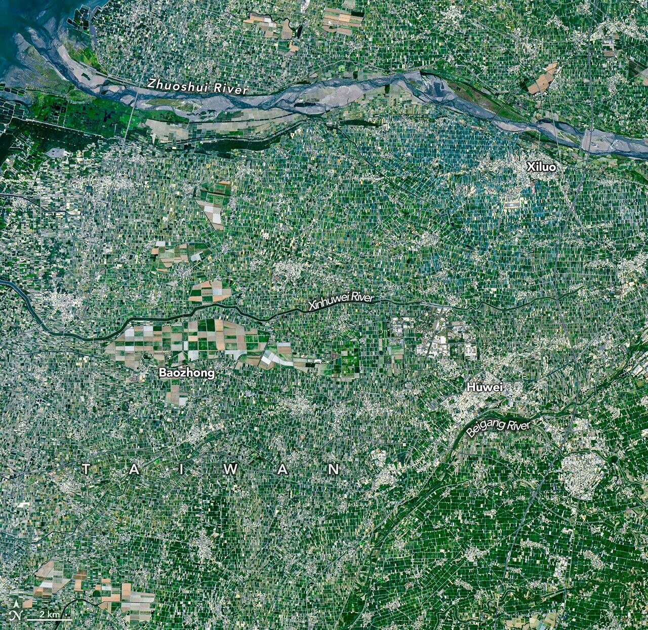 Landsat view of farmland in Taiwan: the kind of land pattern geospatial embeddings summarize, not an AlphaEarth rendering
