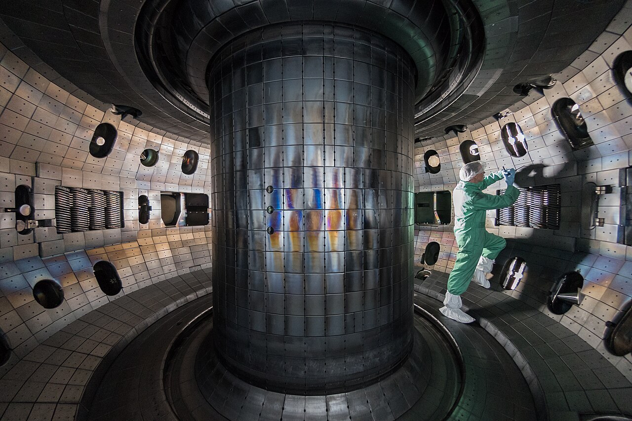 Illustrative stock photograph of a worker inside the DIII-D vacuum vessel during a maintenance period in 2017. It was taken years before the experiment described here.