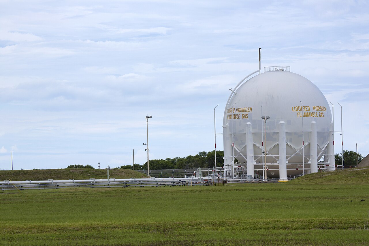 A large cryogenic hydrogen storage tank — the kind of industrial hydrogen hardware already used at launch sites