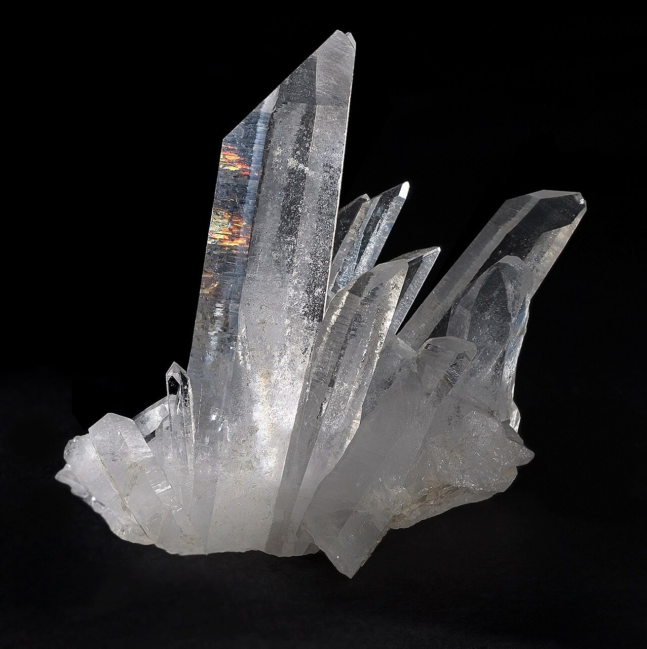 Illustrative stock photograph of a natural quartz crystal cluster from Tibet, shown as an everyday example of a crystal.