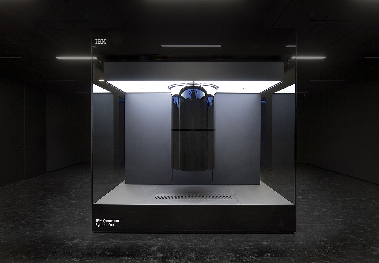 An IBM Q System One-class quantum computer, the chandelier of cables over a dilution refrigerator