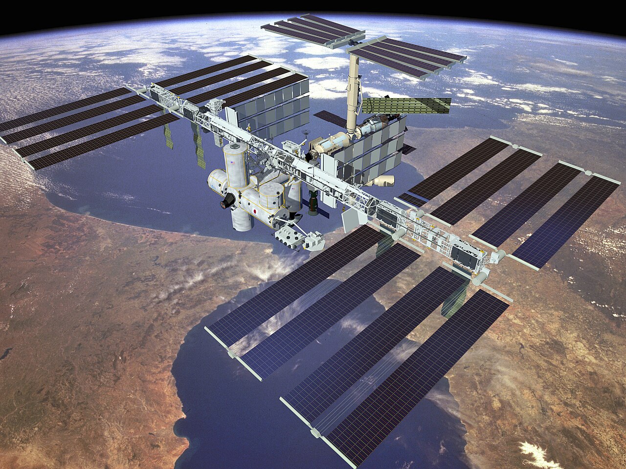 International Space Station solar arrays — the closest working cousin of proposed power satellites
