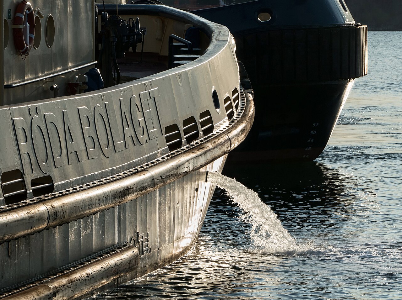 Tugboat Boss discharging ballast water in Brofjorden, Sweden, before departure