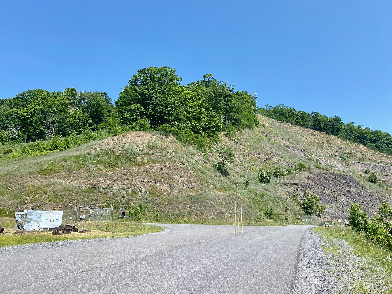 The tree-lined upper reservoir of Bath County Pumped Storage Station held in a mountain bowl