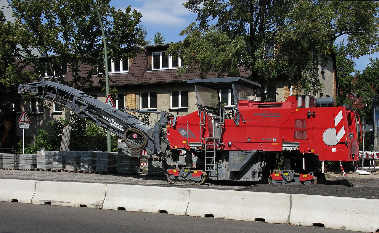 Red Wirtgen W 1500 cold-milling machine parked on a Berlin street