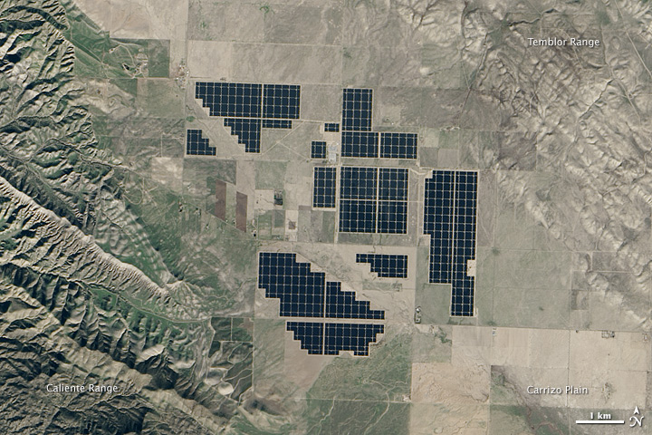 Satellite view of the Topaz Solar Farm: dark rectangular arrays across California Valley